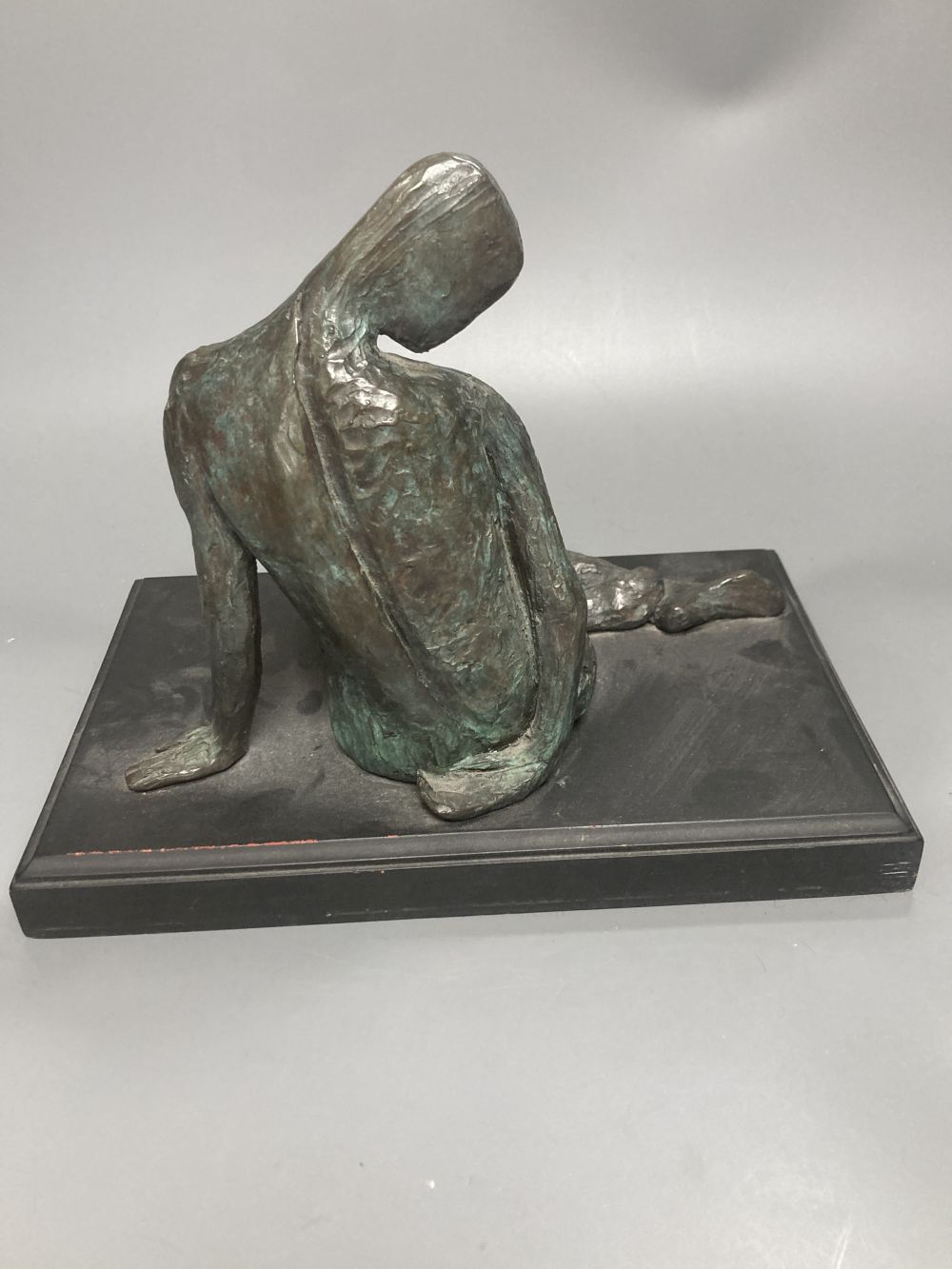 A contemporary bronze figure of a seated female figure, ebonised plinth 29.5cm wide